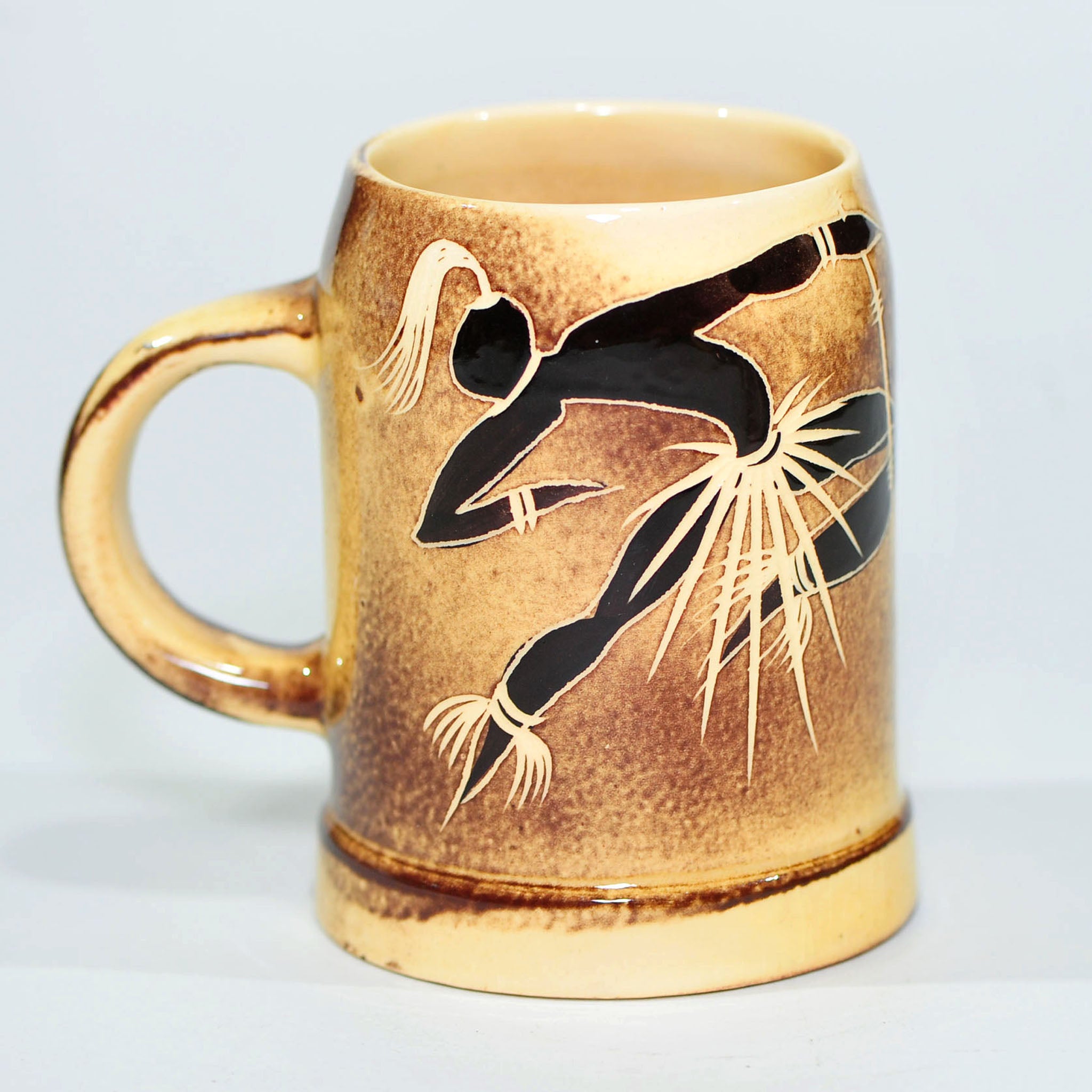 Mug — Attributed to Crescent Potteries (Figure with Staff)